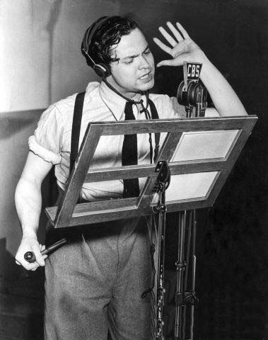 Acting, directing, and monitoring cues simultaneously, 23-year-old Orson Welles rehearses the Mercury Players in this CBS photo from 1938.